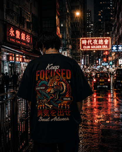Keep Focused tiger graphic streetwear tee on urban night street with neon signs