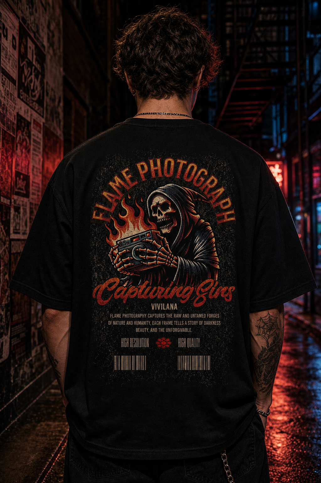 Black graphic tee with skull holding camera, 'Flame Photograph' design, urban alley backdrop